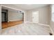 Bright living room featuring a ceiling fan, tiled floors, large window and an open floor plan at 1396 Elizabeth Ln, Atlanta, GA 30344