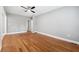Bright living room featuring hardwood floors and neutral walls with an open doorway at 1396 Elizabeth Ln, Atlanta, GA 30344