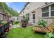 Inviting backyard with artificial turf, brick fence, patio area, wood bench and outdoor decor at 2069 Brightleaf Way # 123, Marietta, GA 30060