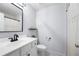 Updated bathroom features a single sink vanity, decorative mirror and shower with lace curtain at 2069 Brightleaf Way # 123, Marietta, GA 30060
