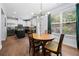 Bright dining area with a modern light fixture, wooden table, and views of the updated kitchen at 2069 Brightleaf Way # 123, Marietta, GA 30060