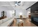 Spacious living room with fireplace, hardwood floors, and seamless open-concept design at 2069 Brightleaf Way # 123, Marietta, GA 30060