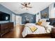 Spacious main bedroom with hardwood floors, a ceiling fan, natural light, and decor at 2069 Brightleaf Way # 123, Marietta, GA 30060