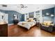 Spacious main bedroom with hardwood floors, a ceiling fan, and decor at 2069 Brightleaf Way # 123, Marietta, GA 30060