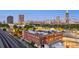 Aerial view with iconic landmarks and expansive city skyline set against a dusk sky at 490 Marietta St Nw # 307, Atlanta, GA 30313