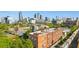 Urban view featuring the city skyline and an apartment building next to a train at 490 Marietta St Nw # 307, Atlanta, GA 30313