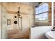 Modern bathroom with a frameless glass shower, tiled walls, and updated fixtures at 490 Marietta St Nw # 307, Atlanta, GA 30313
