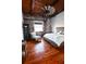 Cozy bedroom features exposed brick, wood floors, and a cozy sitting area at 490 Marietta St Nw # 307, Atlanta, GA 30313