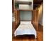 Cozy Murphy bed is tucked away in closet with wood frame and sits on wooden floor at 490 Marietta St Nw # 307, Atlanta, GA 30313