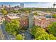 Exterior perspective showcasing an urban building with trees, parking, and city views, emphasizing accessibility at 490 Marietta St Nw # 307, Atlanta, GA 30313