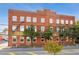 Classic brick exterior featuring multiple windows, fire escape, and street view at 490 Marietta St Nw # 307, Atlanta, GA 30313