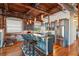 Industrial kitchen with stainless steel appliances, breakfast bar and a brick accent wall at 490 Marietta St Nw # 307, Atlanta, GA 30313