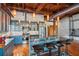 Kitchen with counter seating, stainless appliances, and hardwood floors with exposed ductwork at 490 Marietta St Nw # 307, Atlanta, GA 30313