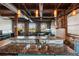 Modern kitchen featuring exposed brick, wood beam ceilings, granite countertops, and stainless steel appliances at 490 Marietta St Nw # 307, Atlanta, GA 30313