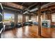 Spacious living room with exposed brick walls, hardwood floors, fireplace, and large windows at 490 Marietta St Nw # 307, Atlanta, GA 30313