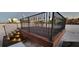 This rooftop deck features attractive lighting on the steps and a black wrought iron railing at 490 Marietta St Nw # 307, Atlanta, GA 30313