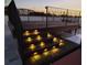 This rooftop deck features attractive lighting on the steps and a black wrought iron railing at 490 Marietta St Nw # 307, Atlanta, GA 30313