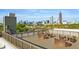 Relaxing rooftop deck with modern lounge furniture, offering residents a private outdoor space with stunning city panoramas at 490 Marietta St Nw # 307, Atlanta, GA 30313