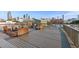 Expansive rooftop deck with wicker seating, offering city views and great outdoor space at 490 Marietta St Nw # 307, Atlanta, GA 30313