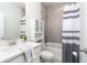 Well-lit bathroom with white vanity, a shower-tub combo, and modern fixtures at 831 Corsiglia Farm Flts, Marietta, GA 30060
