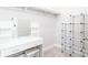 Well-organized closet featuring a vanity area with mirror, open shelving, and ample storage space at 831 Corsiglia Farm Flts, Marietta, GA 30060