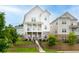 Charming home featuring a brick foundation, two-story porch, and landscaped front yard at 831 Corsiglia Farm Flts, Marietta, GA 30060