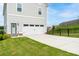Charming home features a two-car garage, welcoming front door, and a well-maintained lawn at 831 Corsiglia Farm Flts, Marietta, GA 30060