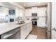 Spacious kitchen with an island, stainless appliances, sleek countertops, and hardwood floors for a modern look at 831 Corsiglia Farm Flts, Marietta, GA 30060