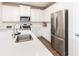 Modern kitchen showcasing stainless steel appliances, white cabinets, a stylish faucet, and quartz countertops at 831 Corsiglia Farm Flts, Marietta, GA 30060