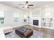 Bright living room featuring a fireplace, built-in shelves, and hardwood flooring at 831 Corsiglia Farm Flts, Marietta, GA 30060