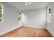 Bright bedroom features hardwood floors, recessed lights, and large windows overlooking the landscape at 1186A Francis Nw St, Atlanta, GA 30318