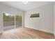 Bedroom with glass sliding door access to balcony and large picture window at 1186A Francis Nw St, Atlanta, GA 30318