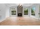 Spacious living room featuring hardwood flooring, a fireplace, and abundant natural light at 1186A Francis Nw St, Atlanta, GA 30318