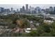 An aerial view of the neighborhood with skyscrapers and mature trees in the background at 1186B Francis Nw St, Atlanta, GA 30318