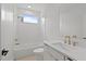 Clean bathroom design offers tub, shower and quartz vanity, plus modern fixtures and lots of light at 1186B Francis Nw St, Atlanta, GA 30318