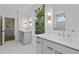 Stylish bathroom with double sinks, quartz countertops, modern lighting, and large windows at 1186B Francis Nw St, Atlanta, GA 30318