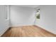 Cozy bedroom with hardwood floors and windows providing natural light and views of the neighborhood at 1186B Francis Nw St, Atlanta, GA 30318