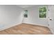 Bright bedroom features hardwood floors, neutral paint, and windows that let in abundant natural light at 1186B Francis Nw St, Atlanta, GA 30318