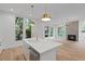 Modern kitchen with island, hardwood floors, and stainless steel appliances at 1186B Francis Nw St, Atlanta, GA 30318