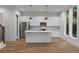 Modern kitchen with stainless steel appliances, white cabinetry, and hardwood floors at 1186B Francis Nw St, Atlanta, GA 30318