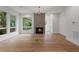 Spacious living room featuring hardwood floors, fireplace, and large windows with a view at 1186B Francis Nw St, Atlanta, GA 30318