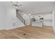Bright and open living space with hardwood floors, modern kitchen, and staircase at 1186B Francis Nw St, Atlanta, GA 30318