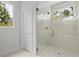 Glass enclosed walk-in shower with bronze hardware, bright tile, and natural light at 1186B Francis Nw St, Atlanta, GA 30318