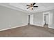 Large bedroom offers a tray ceiling, plush carpeting, and an ensuite bathroom at 3822 River Ridge Ct, Decatur, GA 30034