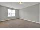 Neutral bedroom with carpet flooring and a bright window at 3822 River Ridge Ct, Decatur, GA 30034