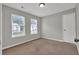Bedroom with neutral walls, carpet floor and two windows at 3822 River Ridge Ct, Decatur, GA 30034