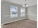 Dining room with neutral walls, carpeting, and natural light from two windows at 3822 River Ridge Ct, Decatur, GA 30034