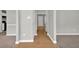 Open hallway featuring views into other rooms with wood and carpet flooring at 3822 River Ridge Ct, Decatur, GA 30034