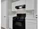 Functional kitchen with black gas range and neutral countertops at 3822 River Ridge Ct, Decatur, GA 30034