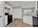 Kitchen featuring modern appliances, ample cabinet space, and tiled flooring at 3822 River Ridge Ct, Decatur, GA 30034